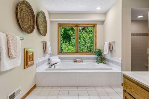 Large spa tub with nature views and handy clothes chute.