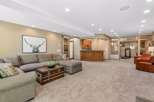 Family room toward wet bar and exercise room.