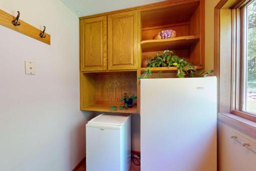 Guild laundry room additional cabinetry and space for extra fridge or freezer or both.