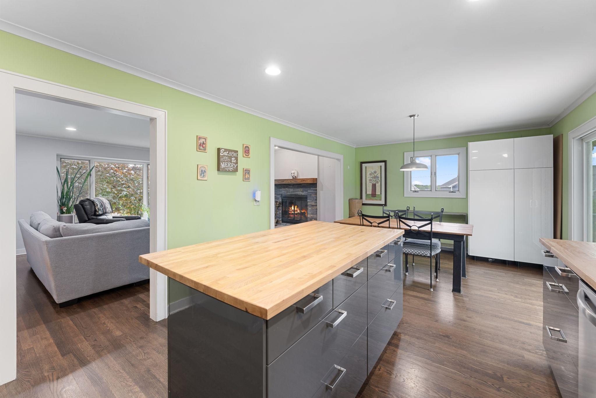 Kitchen Island view flow into dining and living areas