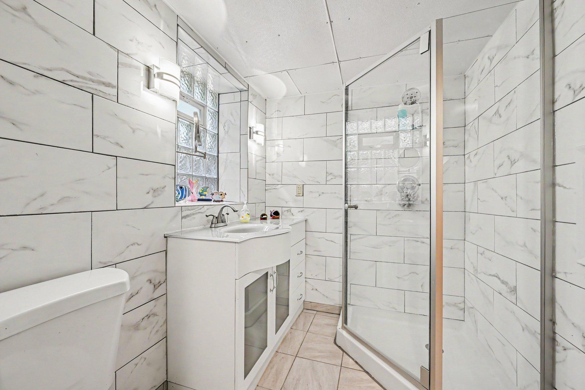Custom tiled lower-level 3/4 bathroom