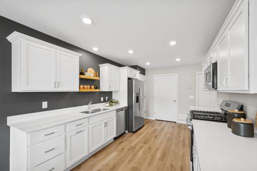 Kitchen - photo of a staged model home of the same floorplan