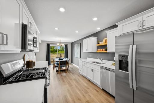 Kitchen - - photo of a staged model home of the same floorplan