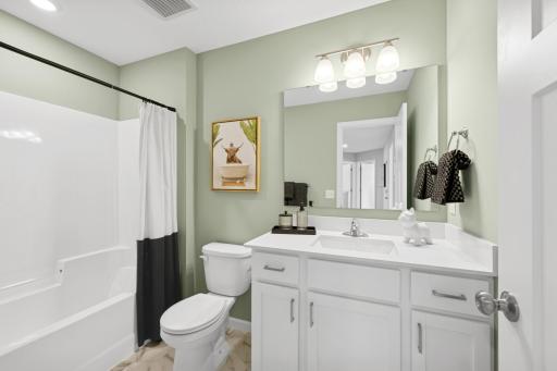 Upstairs full bath - photo of a staged model home of the same floorplan