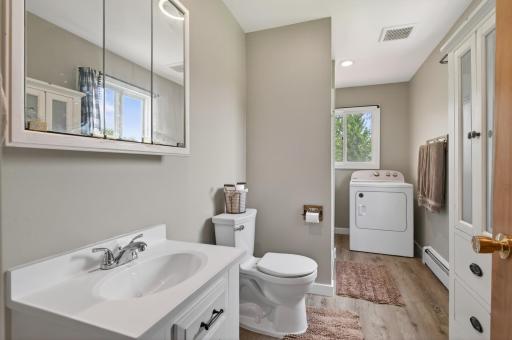 Updated main floor 3/4 bath and laundry complete with new LVP flooring.