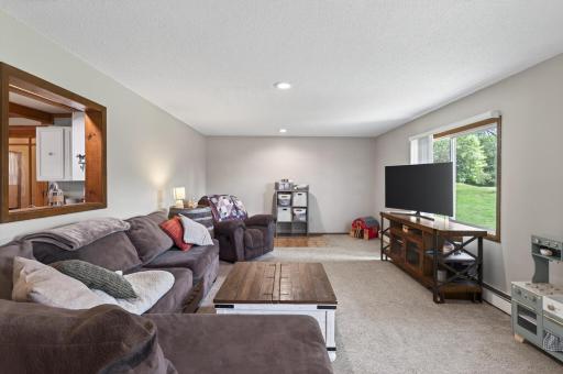 Large family room w/ wonderful views of the private backyard.