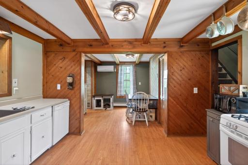 Pergo style flooring runs through the kitchen and dining room.