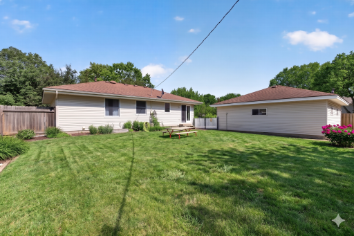 Fully fenced yard is tastefully landscaped with perennials that will come up each year.