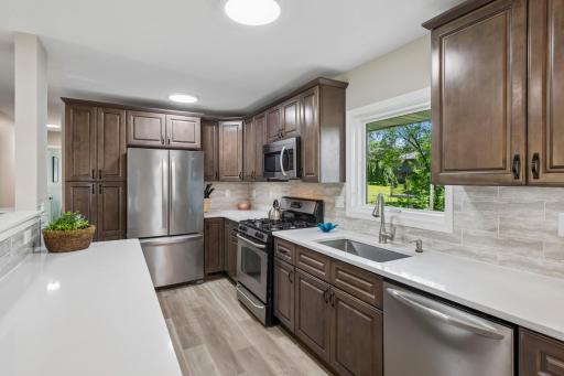 Wood cabinets with soft close drawers and quartz countertops