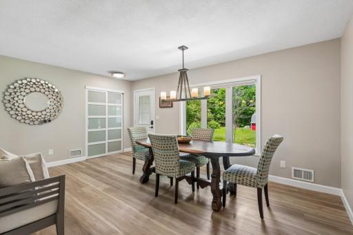Large Dining room with Luxury vinyl flooring