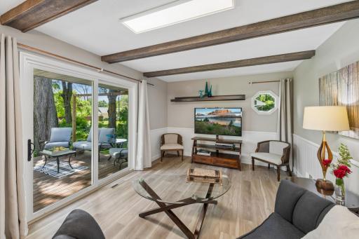 Family room walks out to deck and large level backyard