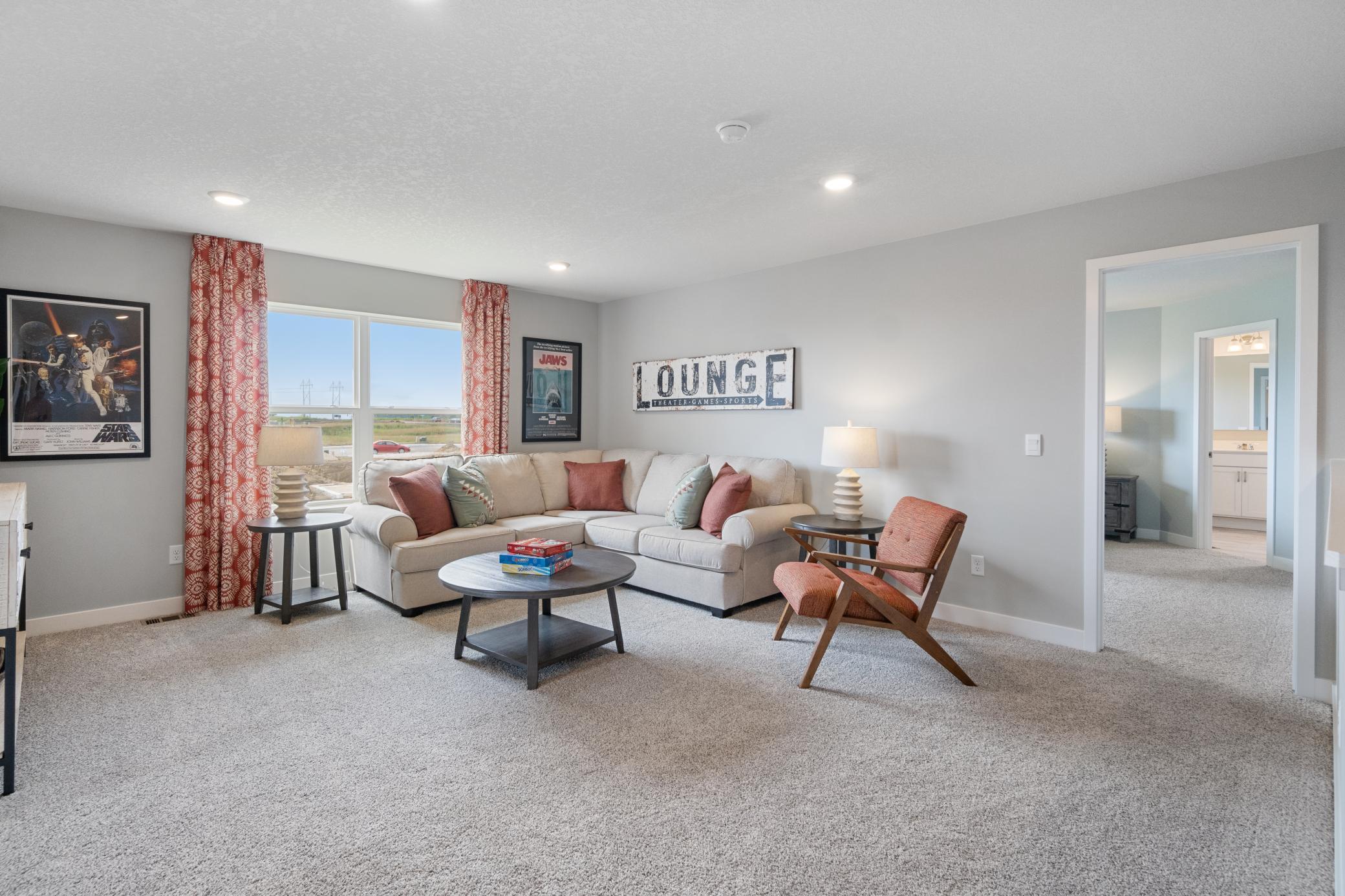 Loft on upper level offers a ton of living options. Leave the games and puzzles out! Photo of prior model home, colors and finishes will vary.