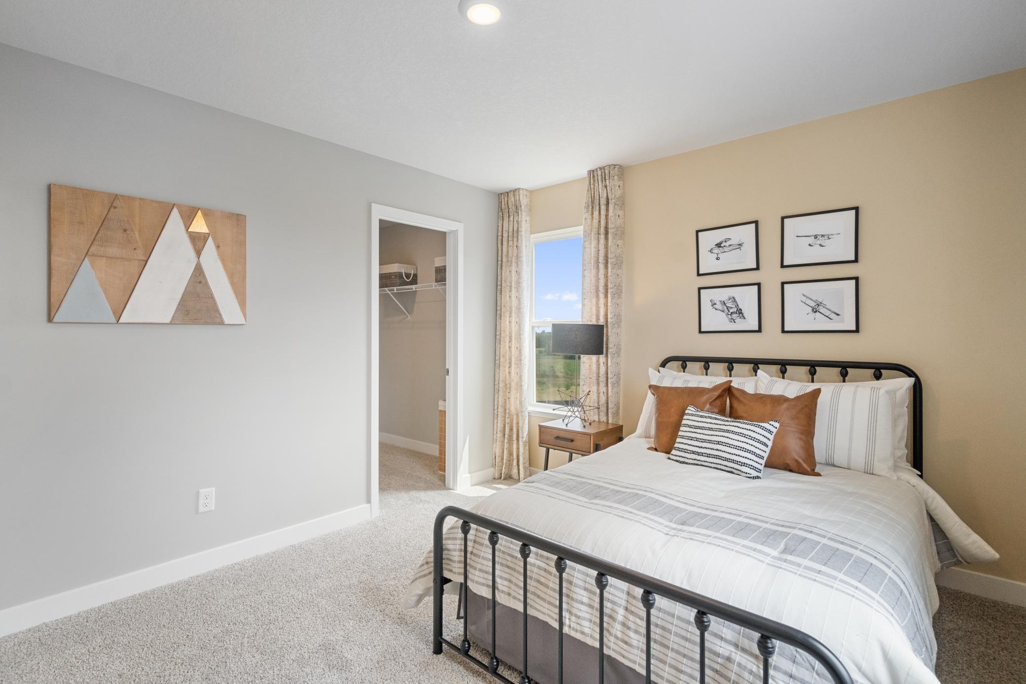 Upper level bedroom 4, another view. Photo of prior model home, colors and finishes will vary.
