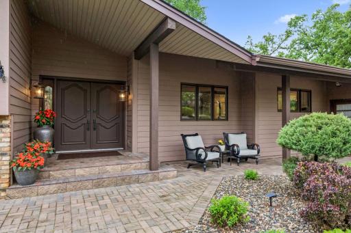 The covered front entry has a welcoming patio seating area. The 0.40 acre lot is completely landscaped.