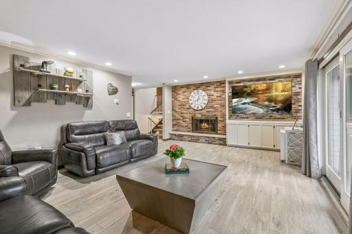 The room has crown molding highlighting by the abundant recessed lighting.