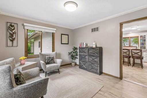 The sellers are utilizing this space as an additional seating area but it could also be reimagined as an office or second dining area.