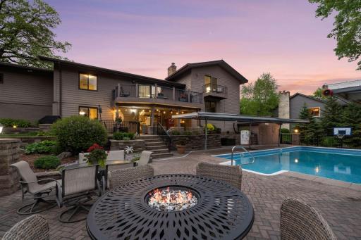 The backyard oasis includes an inground heated pools with extensive paver patios including the walkout level patio with underdeck dry system and a maintenance-free deck.