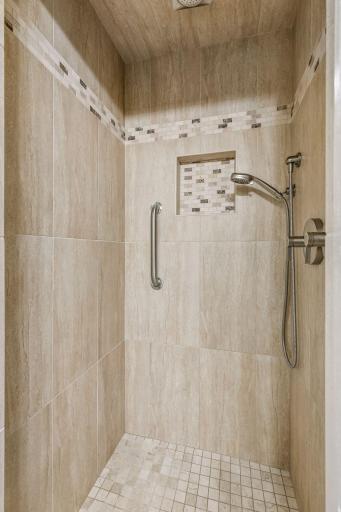 Here is the custom tile shower with a dual shower rainfall shower system.