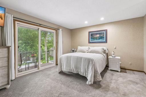 The private primary suite has new carpet and is on the upper level with a private backyard balcony.
