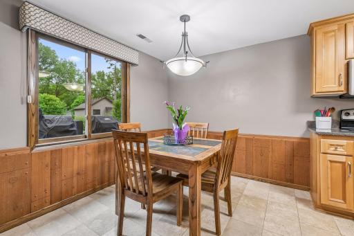 Off the bar is a second kitchen with a informal dining space that could also be used a game or hobby area.