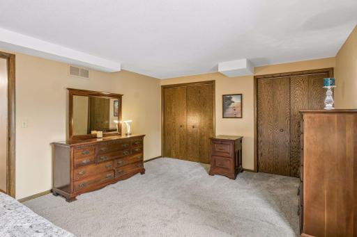 It has new carpet and dual reach-in closets with an additional closet in the hallway.