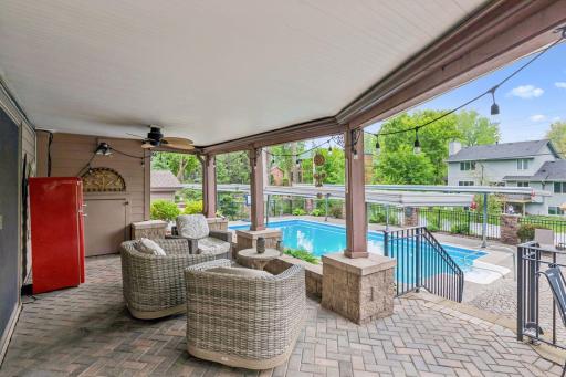 The paver patio off the lower level family room is a great spot to sit and is kept try by an under deck system.