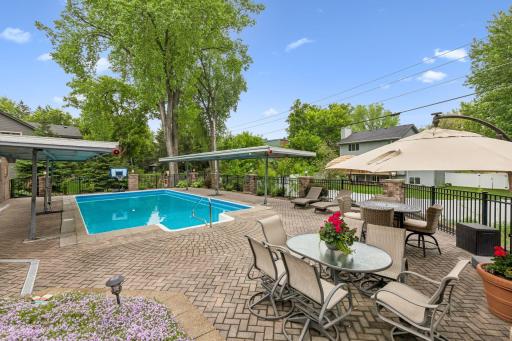 There is extensive patio area surround the pool for dining, grilling or seating space.