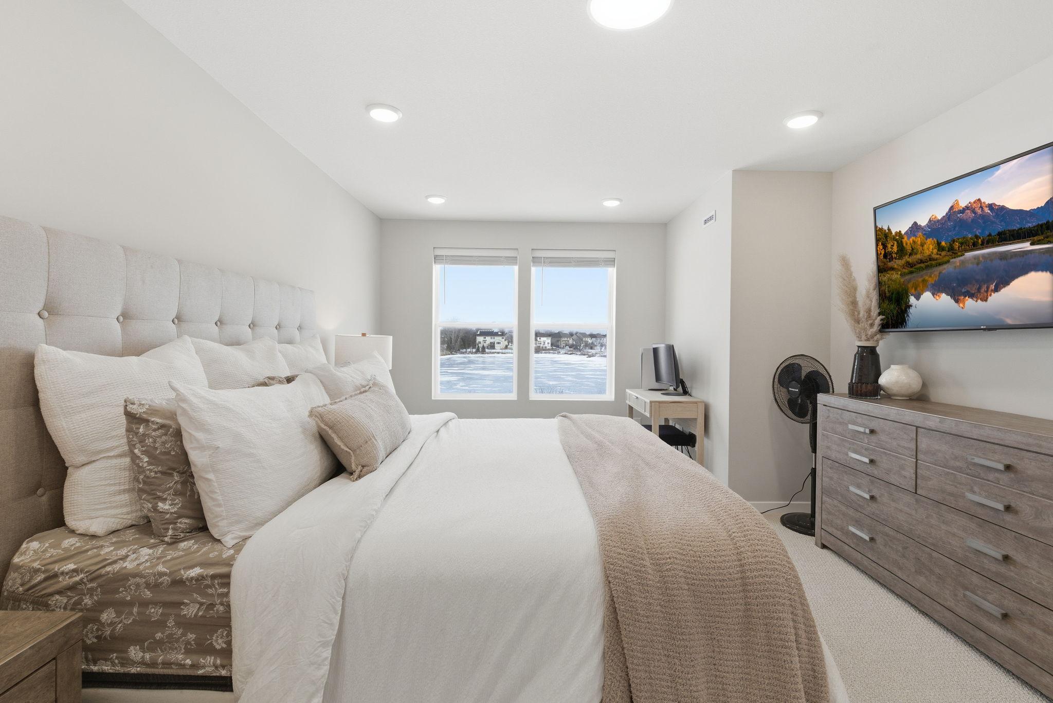 Upstairs you will find a spacious primary bedroom that has a private ensuite bath with walk-in closet. Recessed lighting and double windows frame tranquil pond views & bring in abundant natural light for relaxing and unwinding at the end of your day.