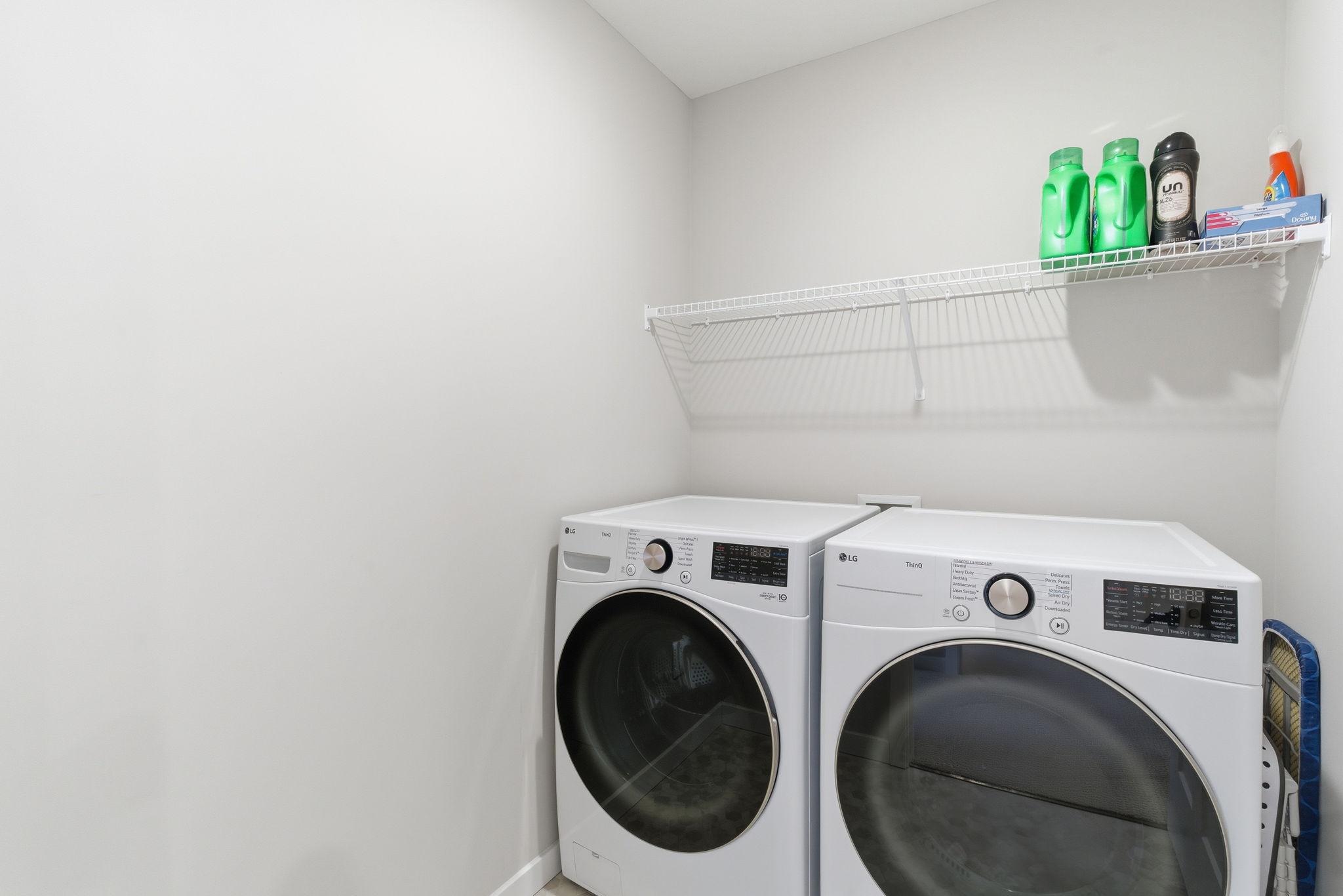 The upper-level laundry room is thoughtfully located just outside the primary ensuite. Includes a shelf, offering added convenience and smart storage right where you need it most, which could be upgraded to cabinetry if desired.