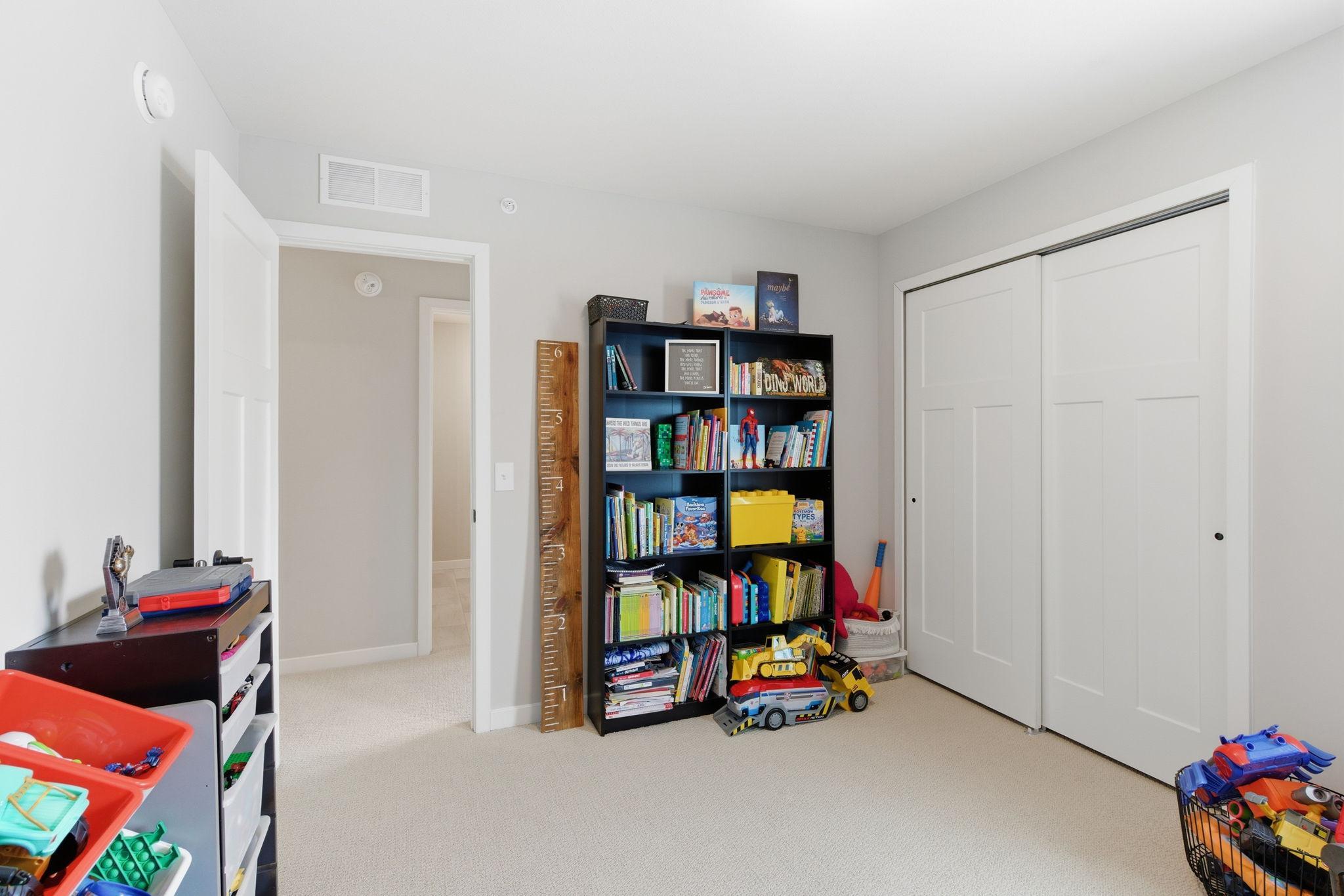 This well-appointed bedroom is conveniently located directly across from the upper-level full bath and includes generous closet space.