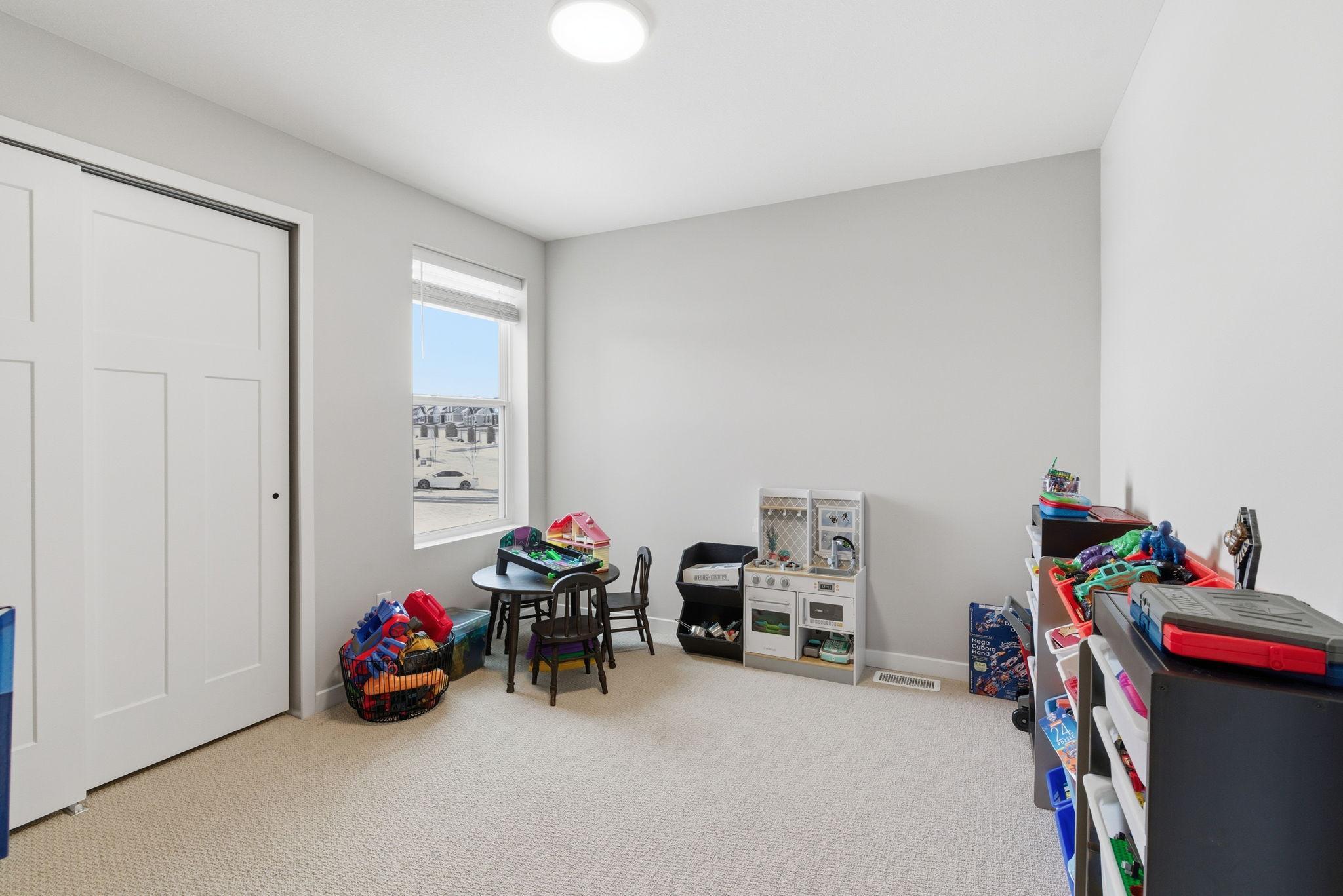 A large window fills the room with natural light, while ample wall space offers flexibility to arrange the room in a variety of ways to suit your lifestyle and design preferences.