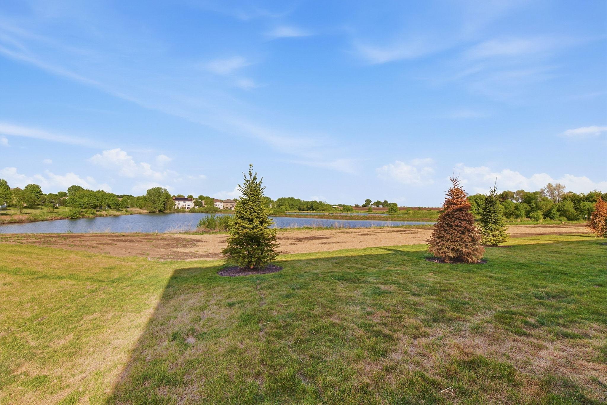 Set against wide-open natural views, the neighborhood offers a rare balance of tranquility & convenience. Snow-dusted ponds & expansive skies provide a serene backdrop, while nearby roads offer easy access to shopping, dining, & everyday essentials.