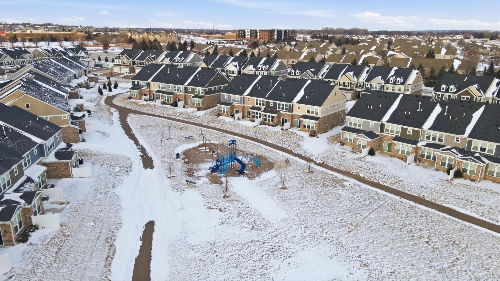 This beautifully planned community offers convenient walking trails and a community playground. These well-maintained residences feature striking exteriors, attached garages, and private driveways, creating a clean, cohesive streetscape.