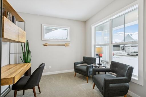Just off the entry is a beautiful study, with views out the front of the home. (Photo of a previously built Summit Floorplan)