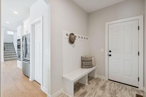 The spacious mud room helps your home stay organized. (Photo of a previously built Summit Floorplan)