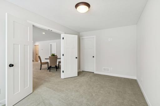 Flex room in lower level allows you to create a space especially for your family's needs - exercise room, playroom, hobby room, etc. (Photo of a previously built Summit Floorplan)