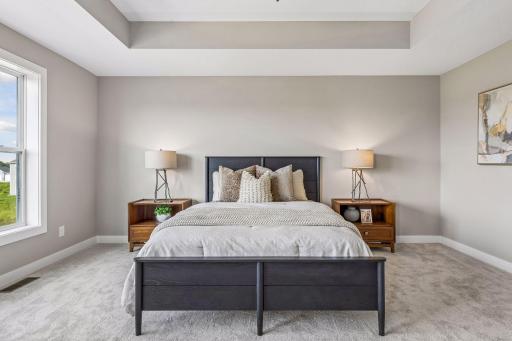 Open the grand French doors into your very own owner's suite with a private bath. (Photo of a previously built Telluride Floorplan)