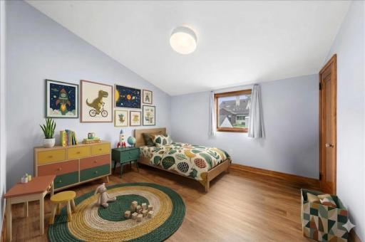 2nd of 3 bedrooms found on the Upper Level of the home - This bedroom was part of an addition which was done shortly after the current owners took possession of the home. - Virtually Staged Image!