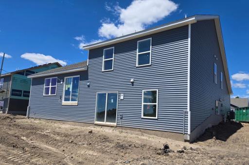 The Cameron II Walkout Lower Level. Photo is of actual home before landscaping. Colors and options may vary. Ask Sales Agent for details.