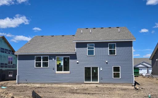 The Cameron II Walkout Lower Level. Photo is of actual home before landscaping. Colors and options may vary. Ask Sales Agent for details.