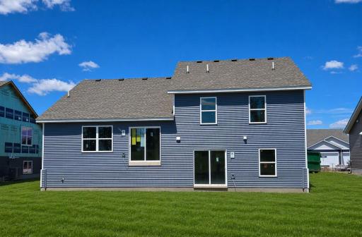 The Cameron II Walkout Lower Level. Photo is of actual home. Colors and options may vary. Ask Sales Agent for details. AI-generated landscaping for visualization. Actual yard condition may differ.