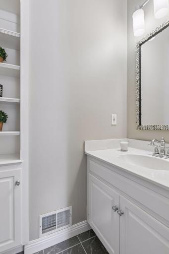 1/2 bath just off garage entrance and lauandry room