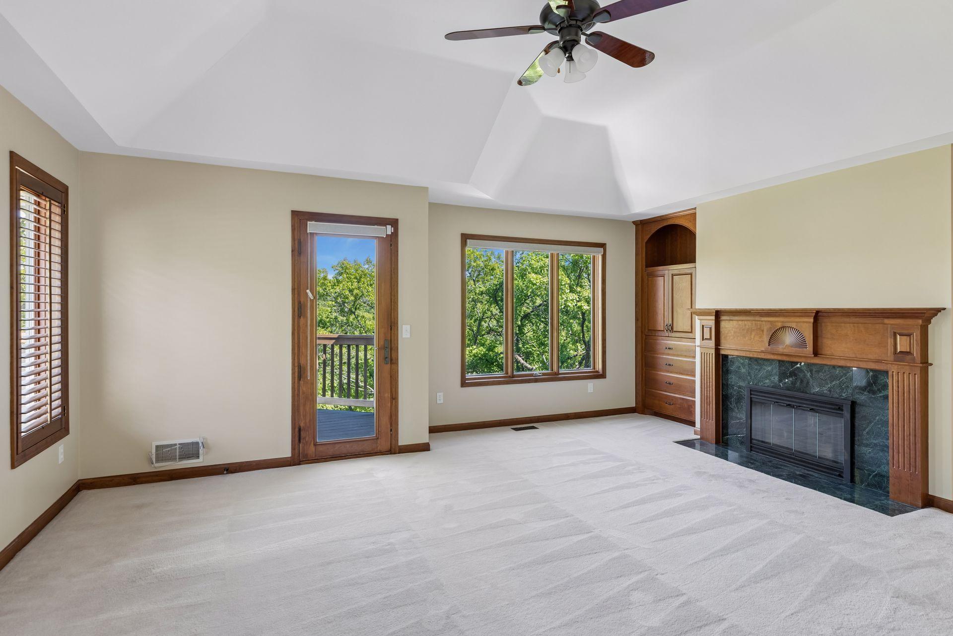 Upper Primary Bedroom with fireplace and it's own deck that overlooks Purgatory Creek
