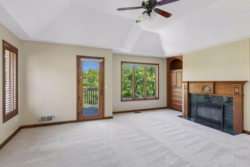 Upper Primary Bedroom with fireplace and it's own deck that overlooks Purgatory Creek