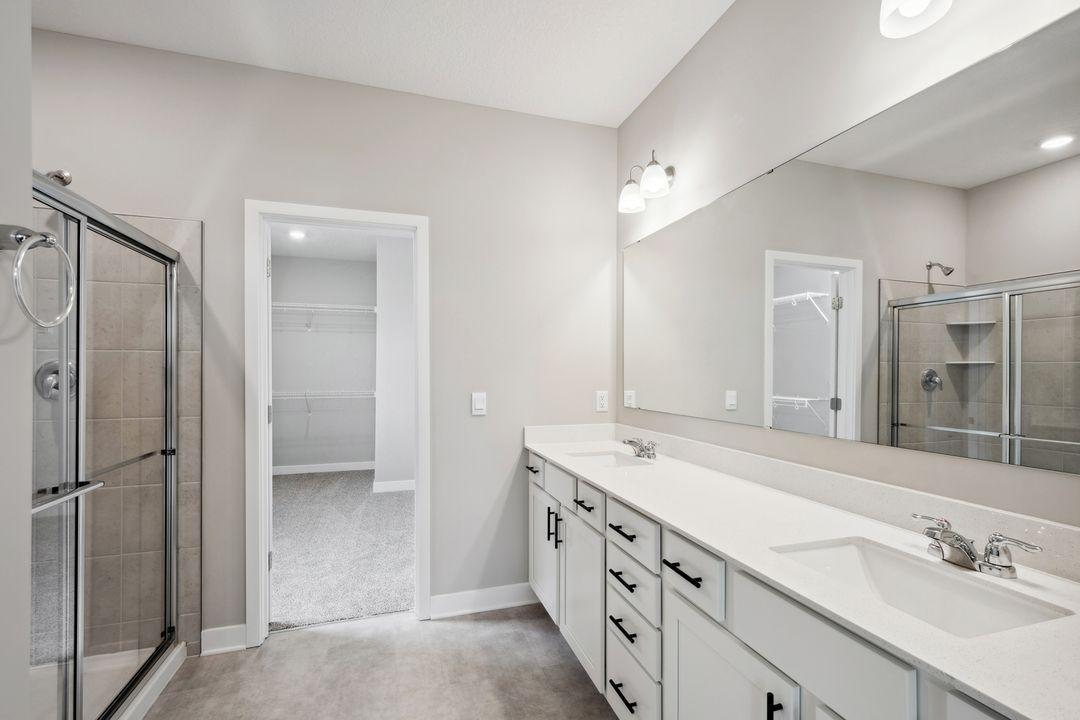 Massive double bowl vanity provides ample storage and bathroom counterspace for your everyday routine. *Picture is of model home; actual finishes may vary.