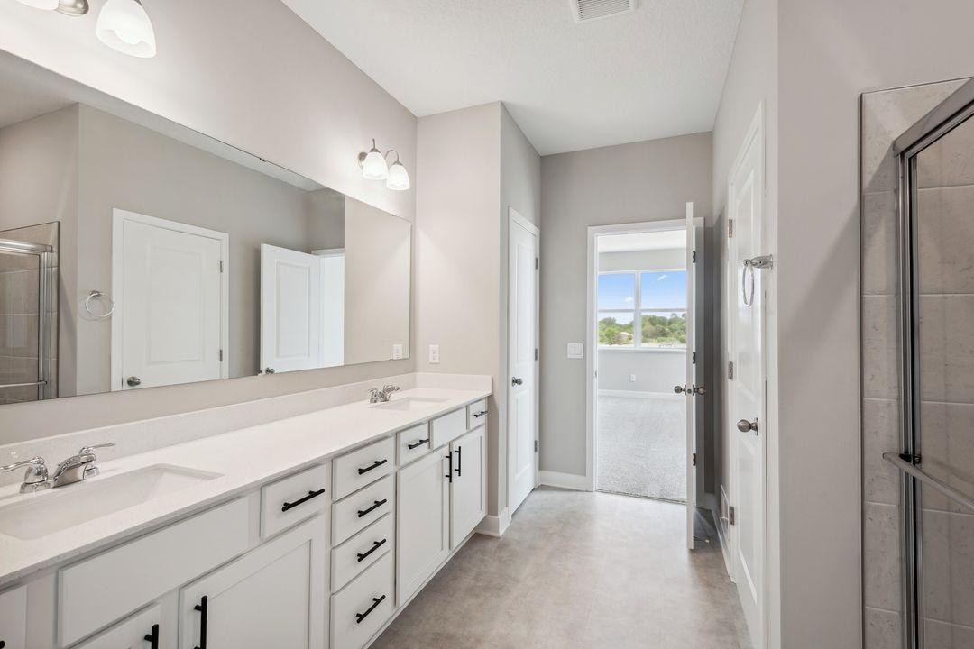 Massive double bowl vanity provides ample storage and bathroom counterspace for your everyday routine. *Picture is of model home; actual finishes may vary.