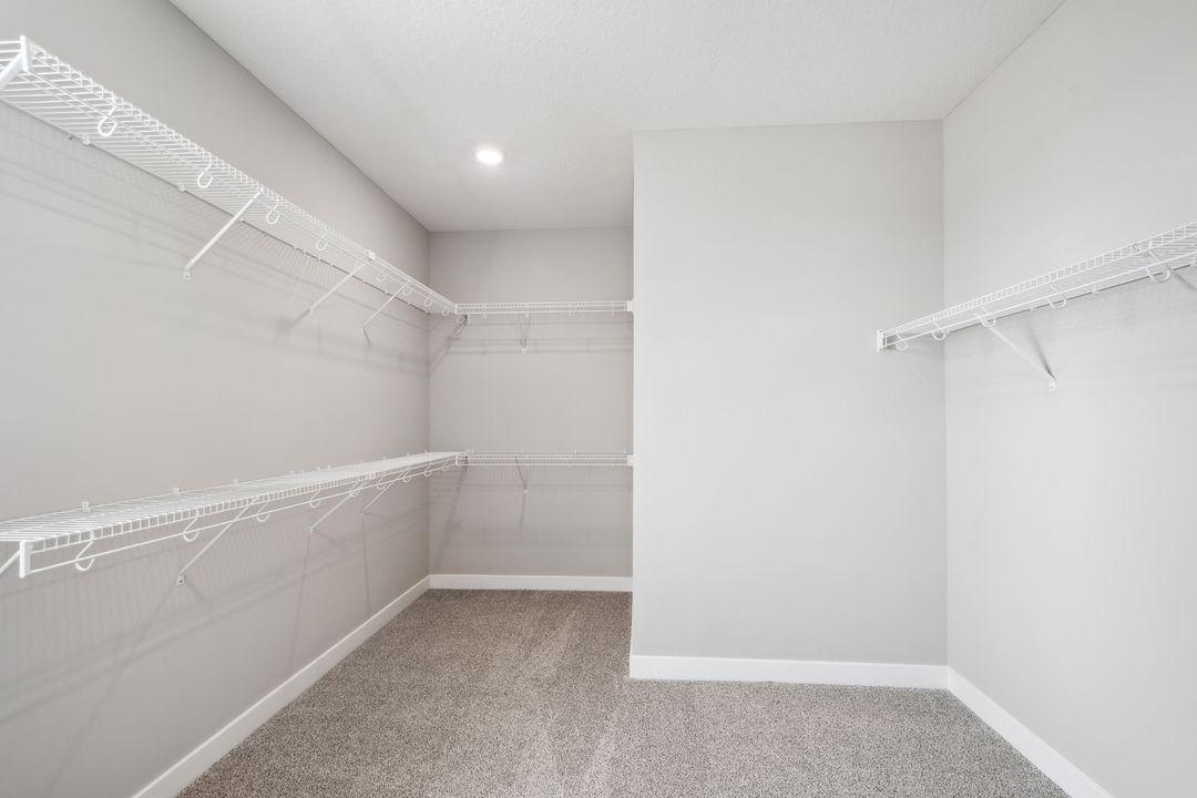 Primary bedroom features two walk-in closets. *Picture is of model home; actual finishes may vary.