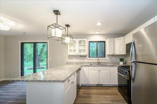 Home has been freshly painted throughout, New LVP flooring and carpet.