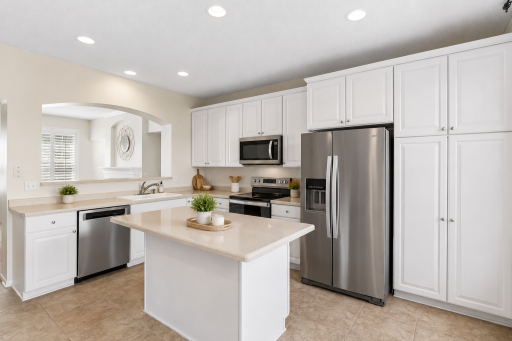Kitchen with newer stainless steel appliances right off the living room.