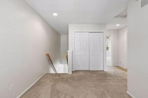 Loft looking to laundry and primary suite.